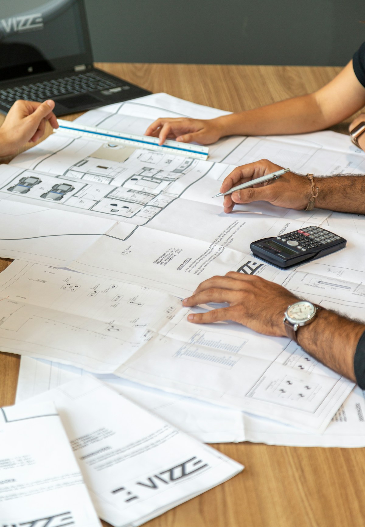 Architectural plans on a desk, reviewing a construction project